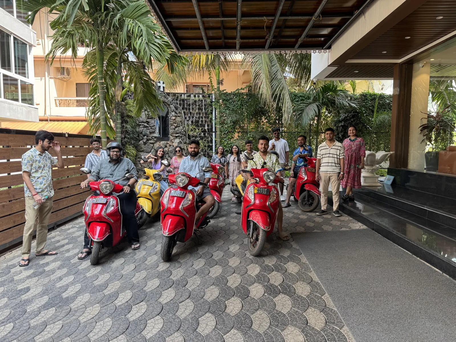 Sharedpro colleagues gathered with scooters before a day out in Goa